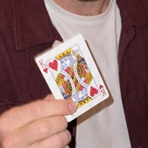 Close-up of a playing card, a king of hearts, in the card trick photo